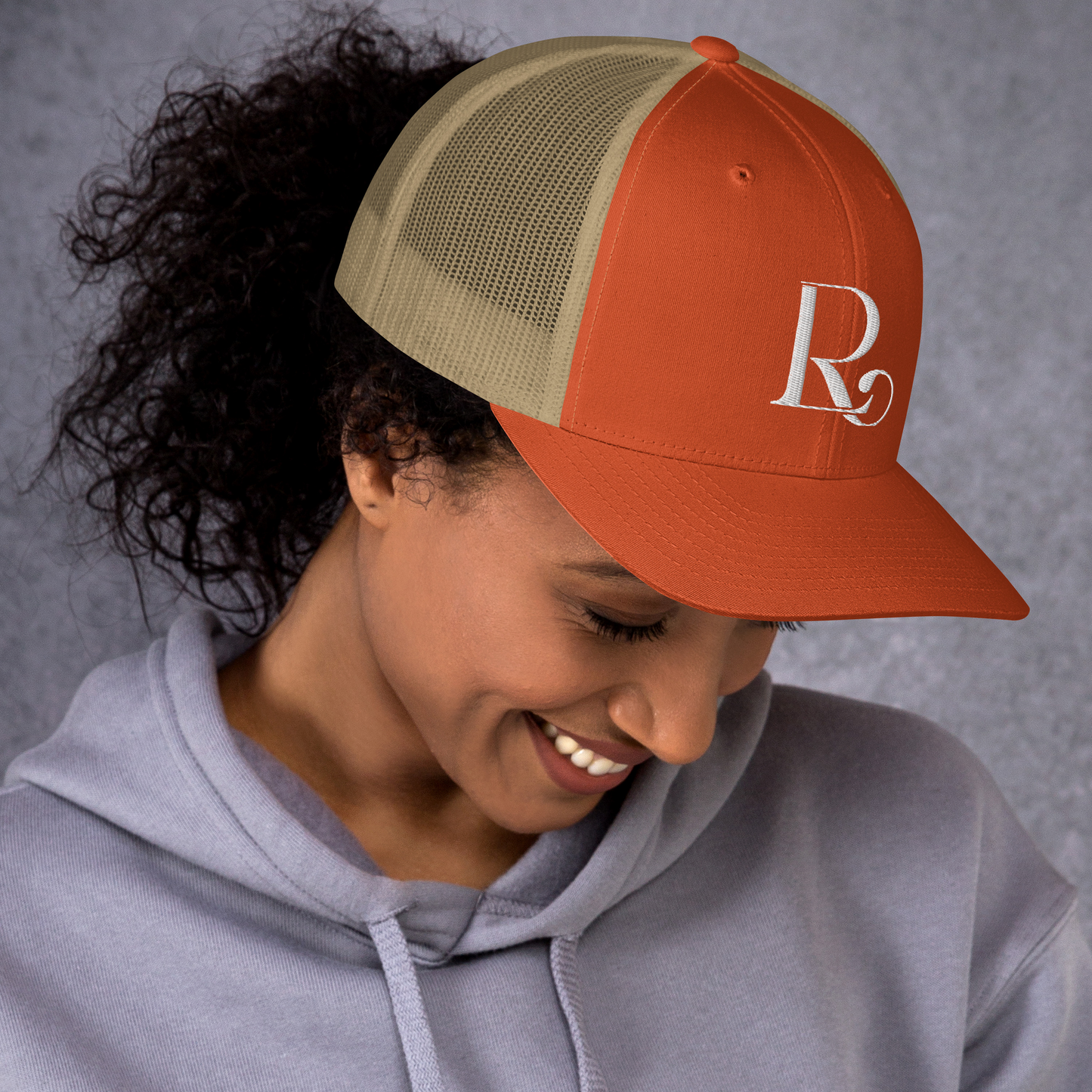 Lioness Resolute Trucker Cap: Crown of Strength and Style